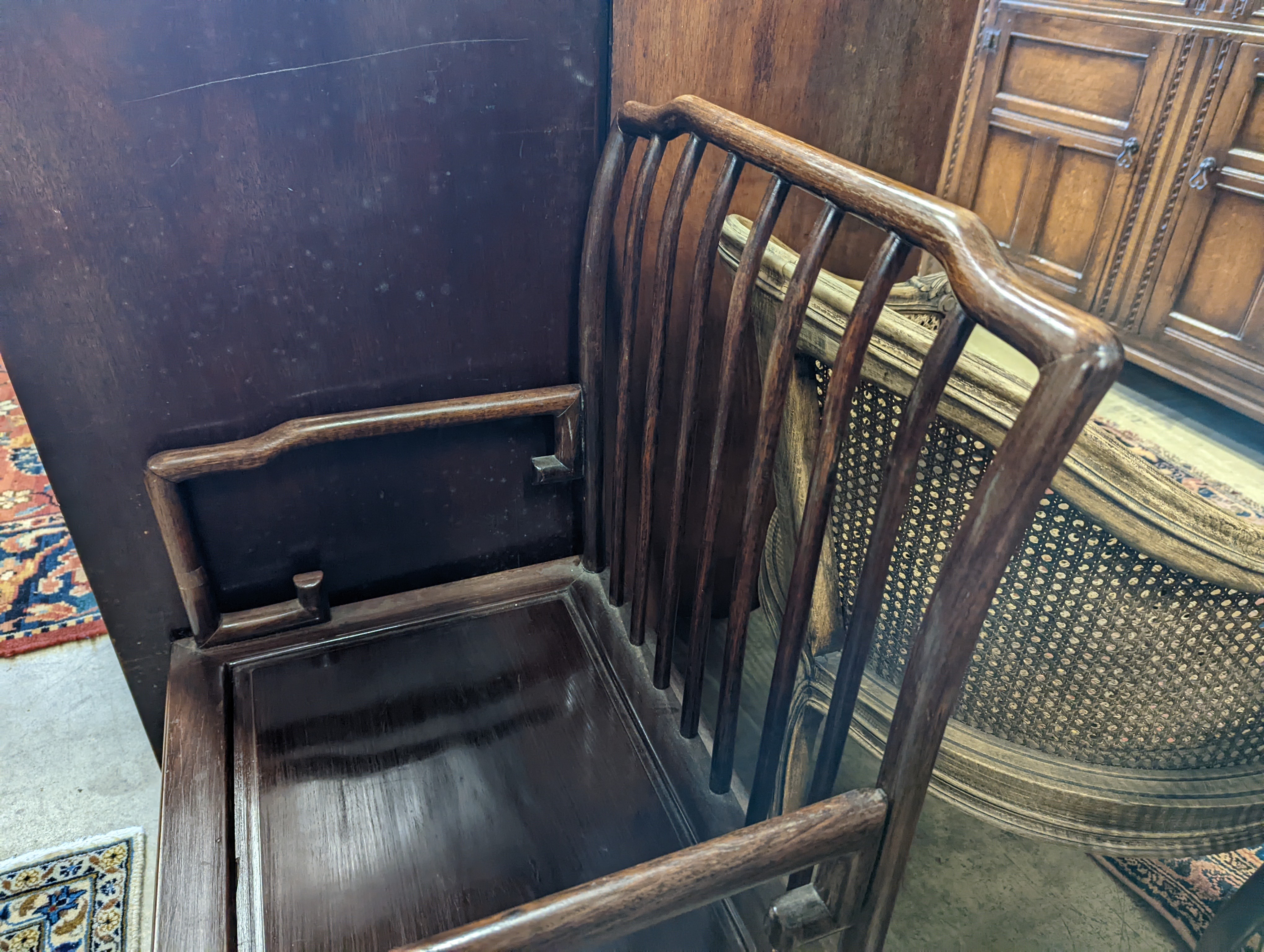 A pair of mid 20th century Chinese Hongmu elbow chairs with cushion seats, width 58cm, depth 49cm, height 92cm